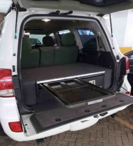 200 series land cruiser twin drawer system with folding table extended partially