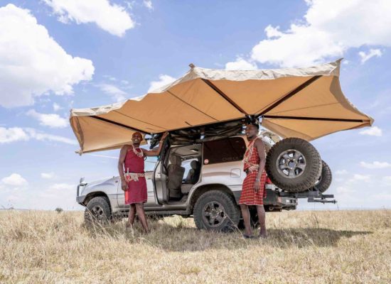 270 degree awning with two Maasai people underneath
